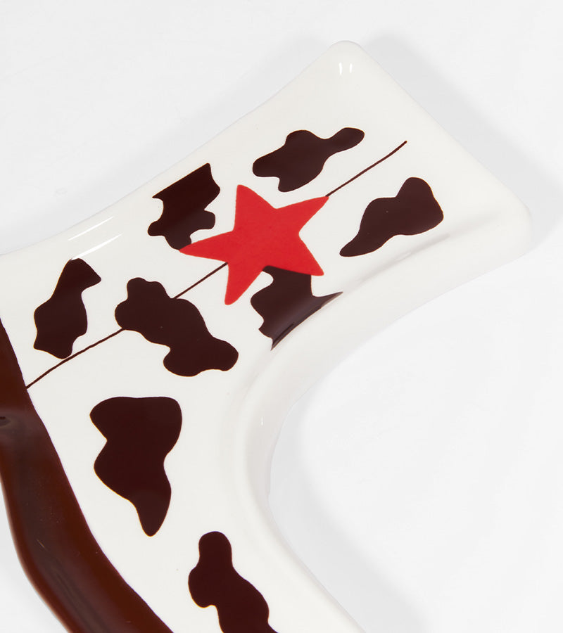 Svuotatasche Santiag a tema mucca